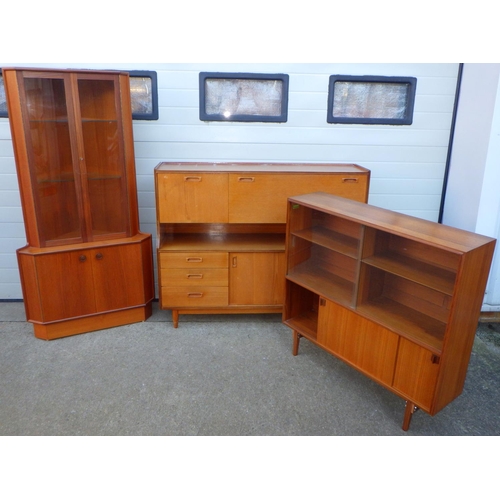 749 - A teak sideboard, 141cm wide together with a low bookcase, feet repaired and a corner cabinet (3)