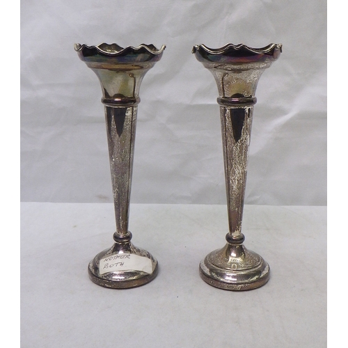 300 - A pair of silver trumpet vases, based loaded.  160mm tall.