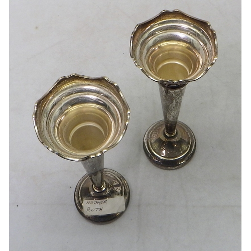 300 - A pair of silver trumpet vases, based loaded.  160mm tall.