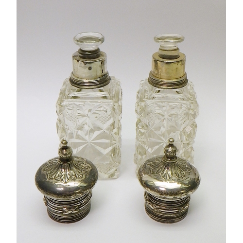 304 - A pair of 19th cent Russian cut glass scent bottles, white metal tops marked for Fyodor Ivanov, Mosc... 