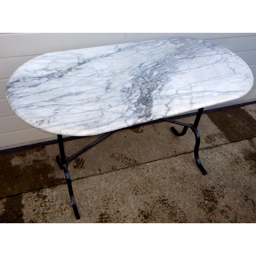 766 - A marble topped cafe table on metal base, 120cm long