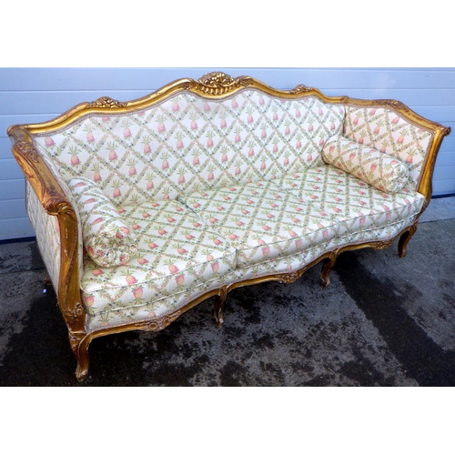 768 - A giltwood framed three seat settee on cabriole legs, frame loose, 215cm wide