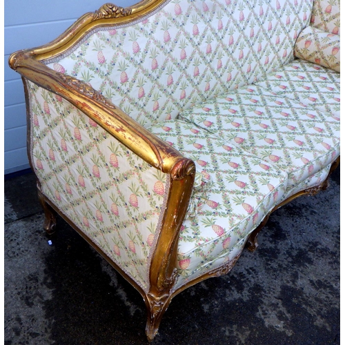 768 - A giltwood framed three seat settee on cabriole legs, frame loose, 215cm wide