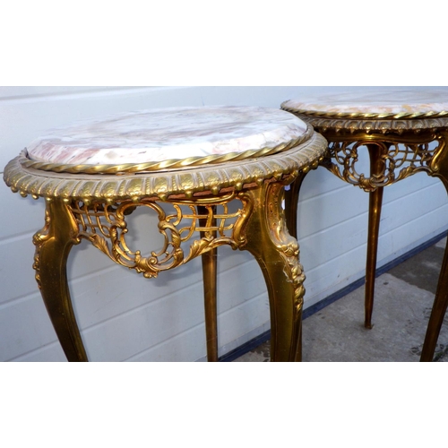 772 - A pair of circular gilt metal stands with marble/stone inset tops, 42cm across