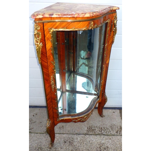A 19th cen kingwood and gilt metal mounted corner cabinet with bowed glass door, 114cm tall,