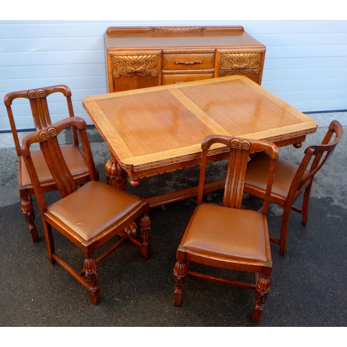787 - A 1930's oak dining suite incl draw leaf table, sideboard & four chairs, one chair missing stretcher... 