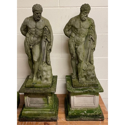 A pair weathered concrete figures of Hercules 85cm high