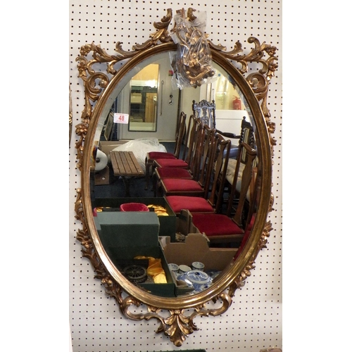 48 - Two gilt framed oval bevelled mirror 65 & 100cm high