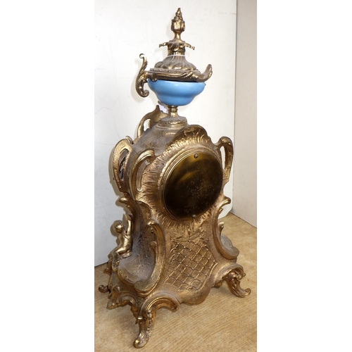 58 - A gilt metal French mantle clock together with an onyx based gilt metal lamp (2)