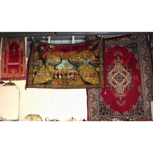 74 - A large peacock rug / wall hanging together with two further  wall hanging (3)