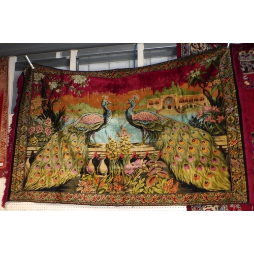 74 - A large peacock rug / wall hanging together with two further  wall hanging (3)
