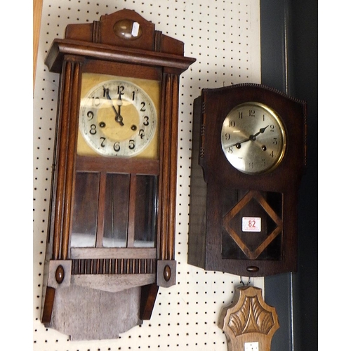 82 - Two oak cased 8 day striking wall clocks 60 & 37cm long