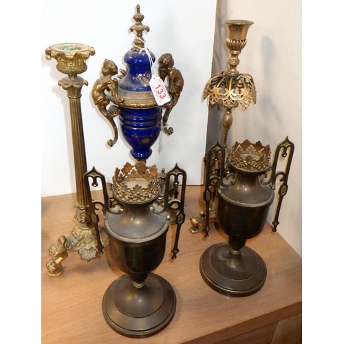 133 - Two cast metal candlesticks together with a pair of stands and an ormulu urn (5)