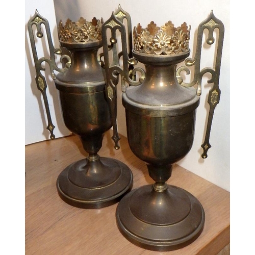 133 - Two cast metal candlesticks together with a pair of stands and an ormulu urn (5)