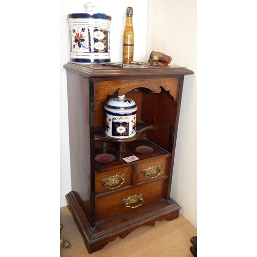 134 - An oak smokers cabinet together with a pipe etc