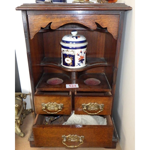 134 - An oak smokers cabinet together with a pipe etc