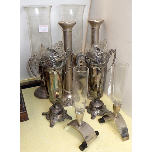 140 - A pair of etched glass hurricane lamps together with a pair of candlesticks and two pairs of spill v... 