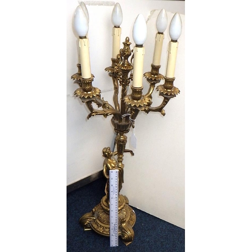 149 - A large heavy cast candelabra 75cm tall