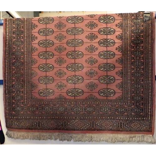 151 - A Turkmen style pink rug 125 x 190cm with two matching runners 65 x 180cm and two small Chinese blue... 