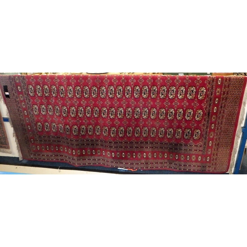 153 - A red ground Bokhara style 250 x 160 cm