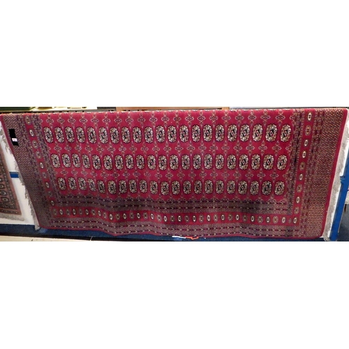 153 - A red ground Bokhara style 250 x 160 cm