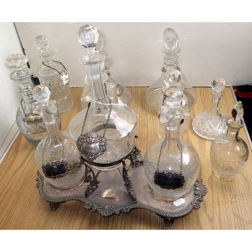 161 - A group of various decanters together with a silver plated stand