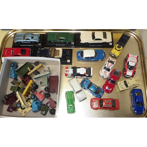 218 - A qty of die cast cars, trucks and trailers and Scalextric track (3)