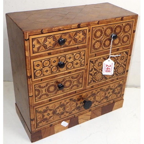 248 - An inlaid table top chest of drawers / jewellery box