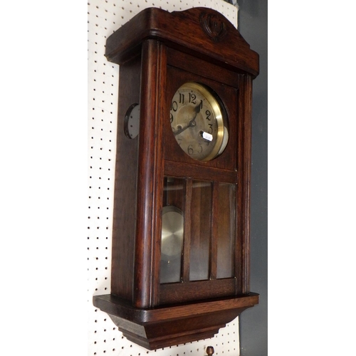 26 - Two 1930s oak cased striking wall clocks 65 & 95cm long