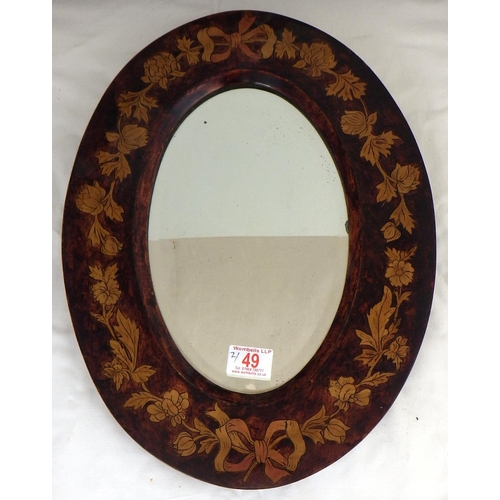 49 - A painted bevelled mirror together with an oval mirror (2)