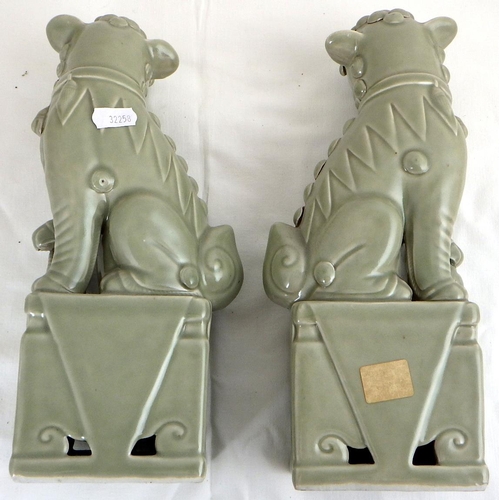 5 - A pair of Chinese celadon lions 30 cm tall, mid 20thC