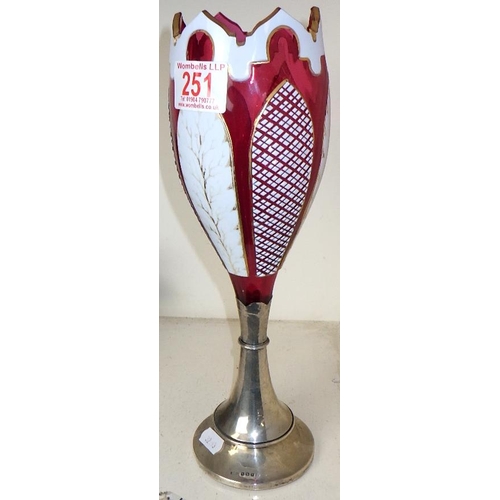 251 - A Bohemian overlay glass vase with a silver base 30cm tall