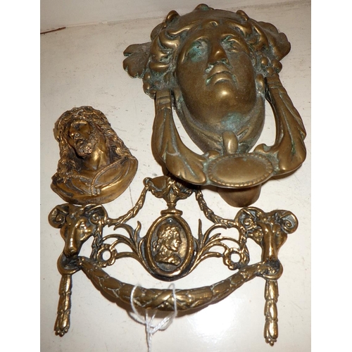 254 - A Brass door knocker together with a handle and a small Christ plaque (3)