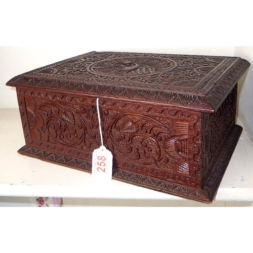 258 - A carved Indian hardwood box 30cm wide