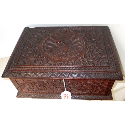 258 - A carved Indian hardwood box 30cm wide