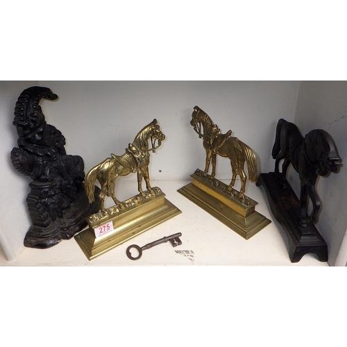 275 - A pair of well cast brass door stops together with a Punch door stop a further horse door stop and a... 