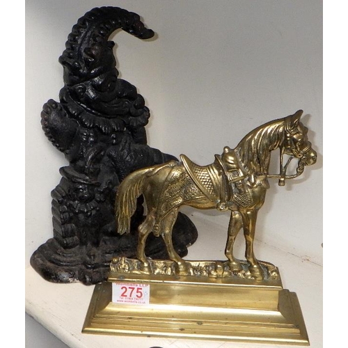 275 - A pair of well cast brass door stops together with a Punch door stop a further horse door stop and a... 