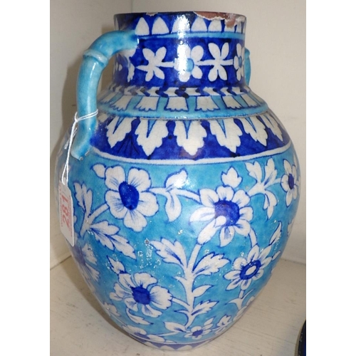 281 - A Multani ? blue painted floral terracotta vase 27cm tall together with a similar pierced plate (2)