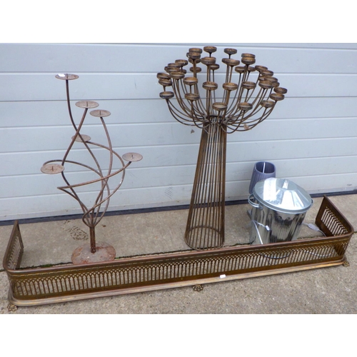 781 - A pierced brass fender, 156cm wide, candle stands etc