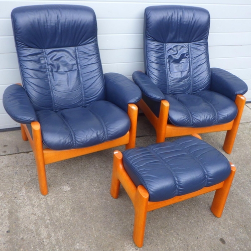 800 - A pair of blue leather stressless armchairs & one stool (3)