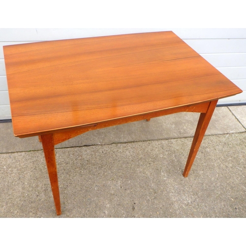 807 - A 1960's walnut draw leaf table, 107cm long closed