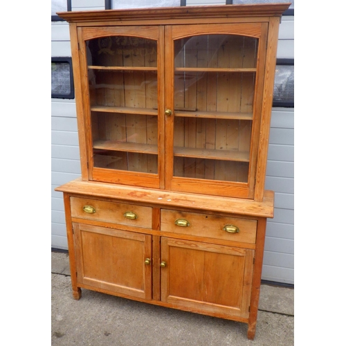 816 - A stripped pine dresser with glazed top, glass a/f, 137cm wide