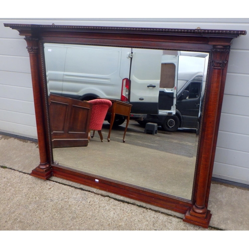 817 - An inverted breakfront mahogany overmantel mirror with turned columns, 134cm wide x 103cm tall