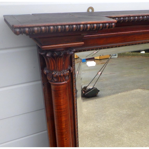 817 - An inverted breakfront mahogany overmantel mirror with turned columns, 134cm wide x 103cm tall