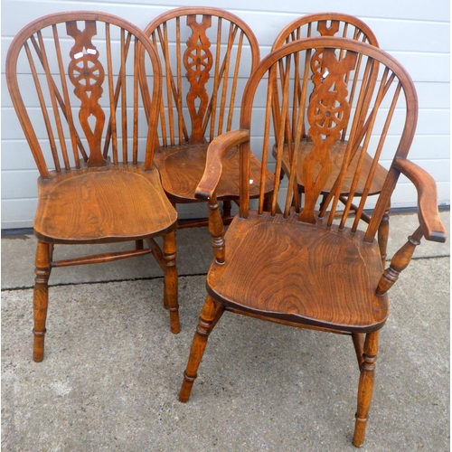 823 - A set of four ash & elm wheelback kitchen chairs incl one carver chair (4)