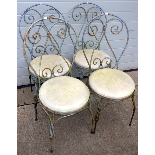 828 - A set of four wrought metal garden chairs