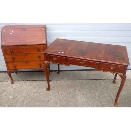 830 - An Edwardian mahogany bureau on cabriole legs, top marked,  together with a reproduction writing tab... 