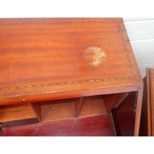 830 - An Edwardian mahogany bureau on cabriole legs, top marked,  together with a reproduction writing tab... 