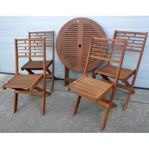 841 - A folding  wooden garden table and four folding chairs (5)