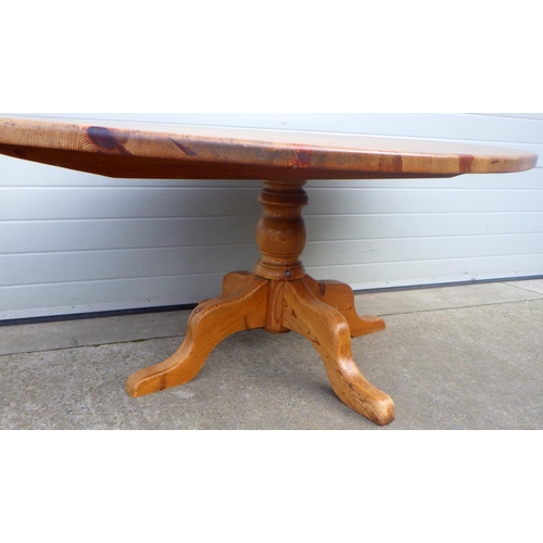 850 - An oval pine kitchen table, 180cm long